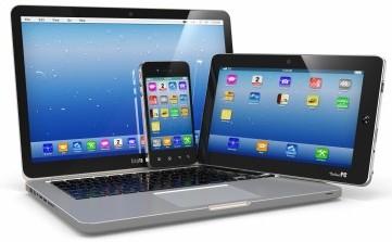 A laptop, tablet and mobile device grouped together