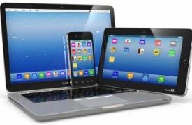 A laptop, tablet and mobile device grouped together